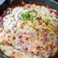 Housemade Lasagna · Layers of pasta and cheese topped with our from
scratch meat sauce then baked until the six-...