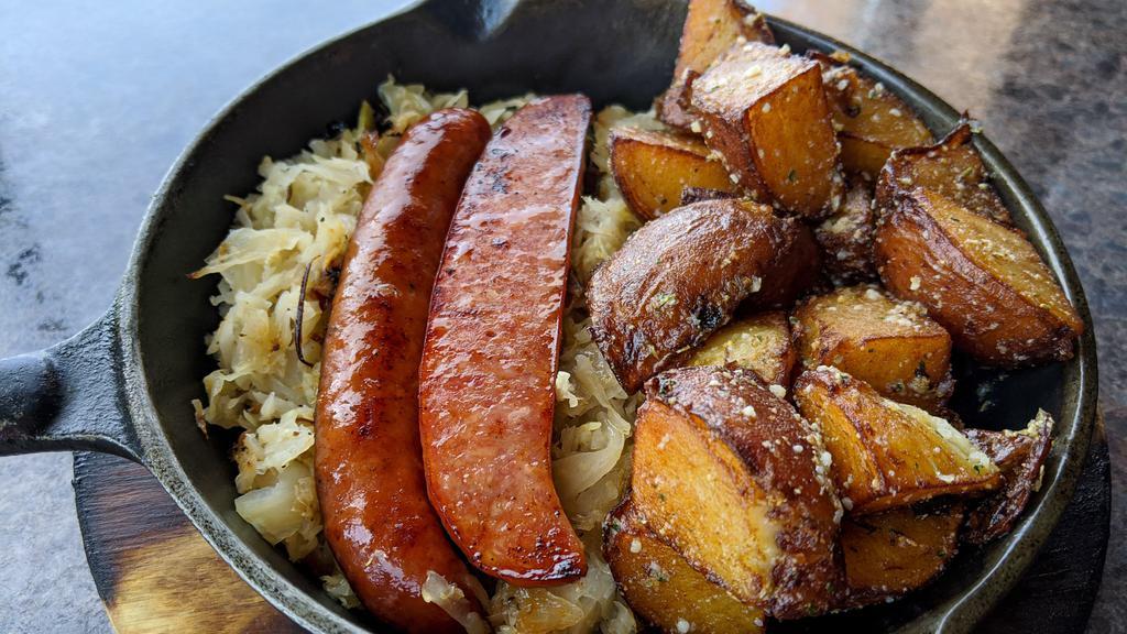 Kielbasa & Sauerkraut · A traditional recipe brought over straight from Poland! Dearborn Polish sausage pan-seared with housemade sauerkraut. Served with your choice of potato, wild rice or fresh vegetable