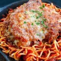 Chicken Parmesan · Fresh breast of chicken topped with marinara sauce and melted house blend cheese. Served ove...