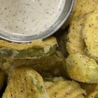 Fried Pickle Chips · White bbq dipping sauce.
