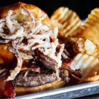 Carnivore Burger · Local schaendorf beef, pulled pork, cheddar, pecan wood smoked bacon, fried onions, sweet an...