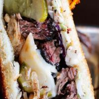 Pulled Beef Sandwich · Pulled briskey, Swiss cheese, sweet & spicy pickles, fried shallots, sweet and smokey bbq, T...
