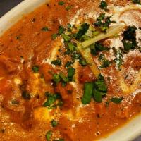 Tandoori Chicken Makhni (Butter Chicken) · Finely cut tandoori chicken tikka sautéed in butter and cooked with blended tomatoes in crea...