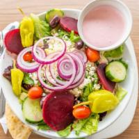 Greek Salad · Lettuce, tomatoes, beets, cucumbers, olives, pepperoncini, onions, feta cheese, and Greek dr...