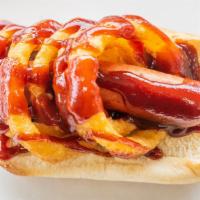 Village Special Dog · Hot dog topped with an onion ring and BBQ sauce.