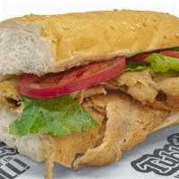 Grilled Chicken Sub · A hearty favorite made with fresh bread, USDA grade A meats,  onions, lettuce, and tomatoes.