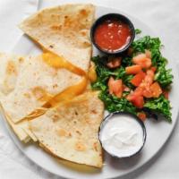 Quesadillas · A Monterey Jack and cheddar filled flour tortilla served with diced tomatoes, sour cream and...