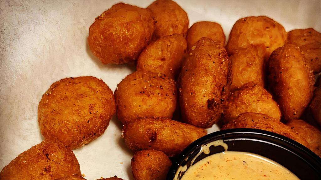 Cheese Curds · A 1/2 lb. of authentic Wisconsin white cheddar cheese curds, beer battered and served with our BTB Spitfire Ranch sauce for dipping.