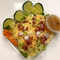 Garden Salad · Mixed greens, cheddar Jack cheese, bacon, croutons, diced tomato, onion, baby carrots, cucum...