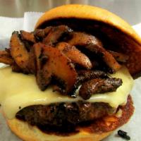 Shroom & Swiss · A flame grilled burger topped w/ Swiss cheese & sautéed mushrooms/bacon.  Served on a brioch...