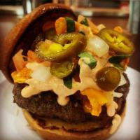 It'S Nacho Burger · A flame grilled burger topped w/ Doritos, melted cheddar jack cheese, lettuce, tomato, onion...