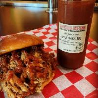 The Notorious Pig · A pile of our savory hickory smoked pulled pork topped w/ your choice of signature BTB BBQ s...