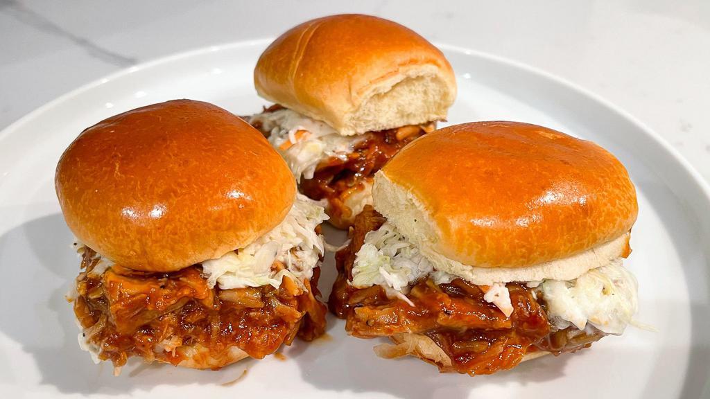 Pulled Pork Sliders · Pulled pork tossed in Smokeheads Carolina BBQ Sauce, topped with our house slaw. Served on a soft brioche Bun.
