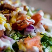 Chopped Salad · Grilled Chicken, Crispy Bacon Pieces, Bleu Cheese Crumbles, Diced Cucumber, Fresh Tomatoes, ...