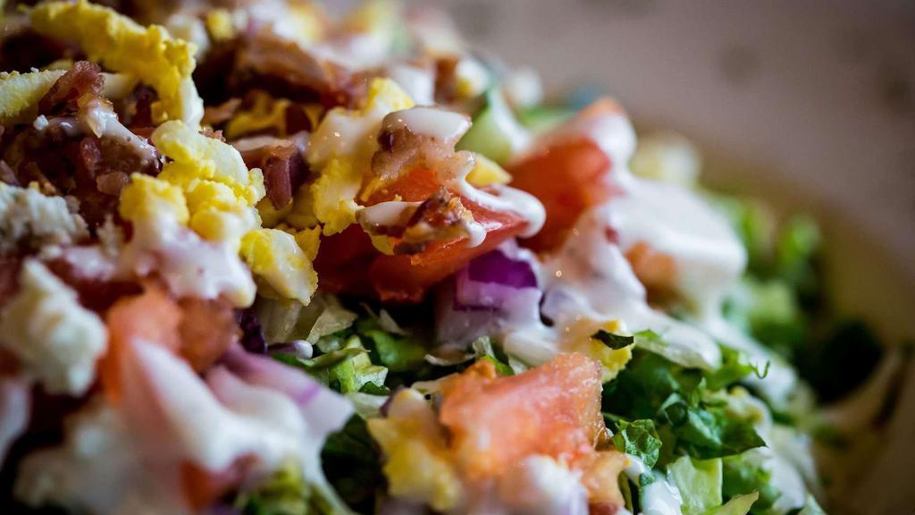 Chopped Salad · Grilled Chicken, Crispy Bacon Pieces, Bleu Cheese Crumbles, Diced Cucumber, Fresh Tomatoes, Avocado, Hard Boiled Egg, Ranch Dressing
