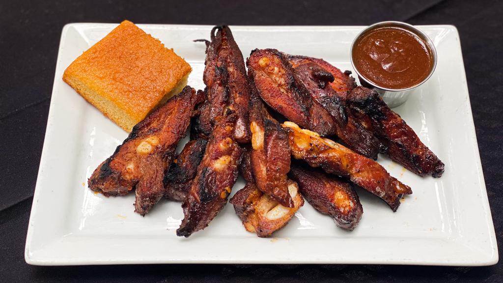 Rib Tips  · One pound of our pork rib tips rubbed with our Smokeheads Sweet and Tangy Dry Rub and slow smoked over a blend of hickory and apple woods. Finished on the grill and served with your choice of our signature BBQ sauce and a side of cornbread.