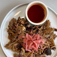 Carolina Style Pulled Pork · Each bone-in pork shoulder is marinated in our Smokeheads Signature Dry Rub and smoked with ...