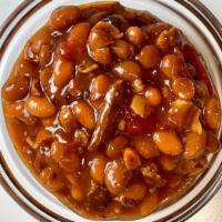 Brisket Baked Beans · Our Brisket Baked Beans include plenty of burnt ends, thick cut bacon, pinto beans, a lil’ b...