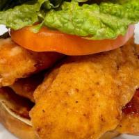 Fried Chicken Tender Sandwich · Double breaded and fried Chicken Tenders, Lettuce, Tomato, Brioche. Choice of Sauce. Served ...
