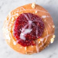 Raspberry Bullseye  · Soft raised donuts topped with raspberry jam and sprinkled with cake crumble