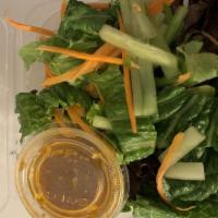 House Salad · Served with ginger dressing.