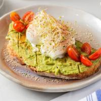 Avocado Toast · Vegetarian. Rustic French country bread smothered with creamy avocado, topped with tomatoes ...