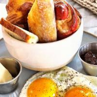 French Breakfast · Homemade fresh bread and pastries basket, two eggs any style, jam, and butter, orange juice ...
