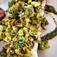 Brussel Sprout Bruschetta (V) · Fried brussels sprout leaves ricotta, pesto served with a Honey roasted lemon drizzle