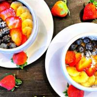 Parfait Granola  · Fresh Greek yogurt, rolled oats, nuts, fresh fruits.