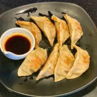 Pork Gyoza ( 8 Pcs.) · Hand-made pot stickers stuffed with seasoned ground pork, minced ginger, Napa and chives.