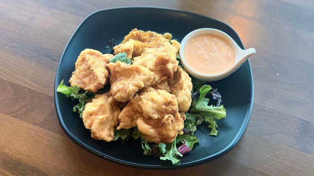 Karaage Chicken · Juicy fried chicken thigh with an original garlic pepper. Served with mixed baby greens and house-made spicy mayonnaise.
