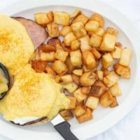 Eggs Benedict · 682 c. The Le Peep way! Poached eggs and Bavarian ham stacked on top of a toasted English mu...
