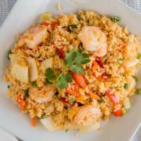 Tom Yum Fried Rice · Stir-fried rice with egg, red bell pepper, yellow onions, green onions, peas, and carrots.
*...