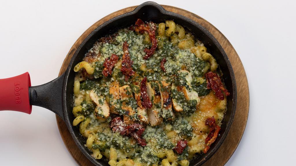 Tuscan Chicken · Yellow mac sauce, sun-dried tomatoes, spinach, pesto, grilled Tuscan chicken
