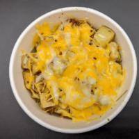 Cheesy Potatoes · Perfectly roasted hand cut potatoes with melted cheese.  Add your choice of a variety of top...