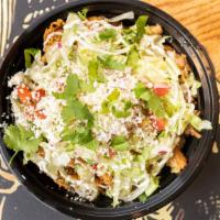 Burrito Bowl · Rice, beans, chihuahua cheese, lettuce, crema, salsa verde, and choice of meat.