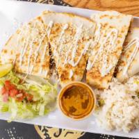Quesadilla · Crispy flour tortilla with chihuahua cheese choice of meat.
