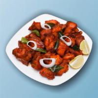 Kung Fu Chicken  · Marinated chicken deep-fried, sautéed with seasoned peppers, onions, and curry leaves.