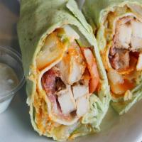 Buffalo Chicken Wrap · Tender chicken with cheese, bacon, red onion and greens. Served with Buffalo sauce and blue ...