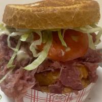 Dinty Moore · Corned beef (8 Oz), Swiss cheese, Russian Dressing, Lettuce,  Tomato, Onion Roll
No substitu...