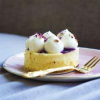 French Cheesecake · Vanilla bean cheesecake atop a delicate vanilla sponge cake, topped with scratch made bluebe...