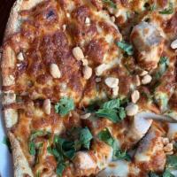 Thai Chicken Pizza · Grilled Chicken, carrot, jalapeno, Thai peanut sauce, mozzarella, topped with peanuts and ci...