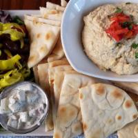 Hummus Plate · House ground hummus with roasted red peppers, kalamata olives, pepperoncinis, cherry tomatoe...