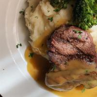 Grilled Filet · Grilled beef tenderloin topped with mushroom demi-glace, served with white cheddar mash & se...