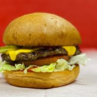 Classic Cheeseburger · 1/4 lb. Premium Angus Beef.  Lettuce, tomato, pickles, ketchup & mayo on a Brioche Bun.