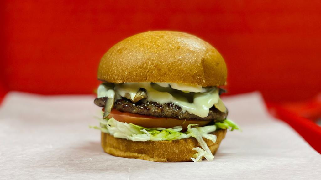 Mushroom & Swiss Burger · 1/4 lb. Premium Angus Beef.  Lettuce, tomato, pickles & mayo.