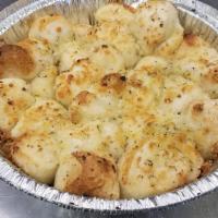 Garlic Parmesan Blast · Small bites of bread in a garlic parmesan butter blend and cooked to a slight crisp. With Ma...
