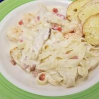 Chicken And Shrimp Carbonara · Grilled Chicken and Gulf Shrimp sauteed with Red Onions, Roasted Red Bell Peppers, and Bacon...