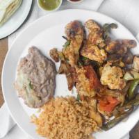 Fajitas · Choice steak or chicken, green peppers, onions, tomatoes.
