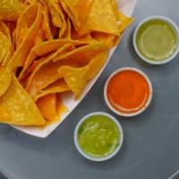 Regular Nachos · Tortilla chips, nacho cheese, lettuce, tomato, sour cream, guacamole, beans and mozzarella c...